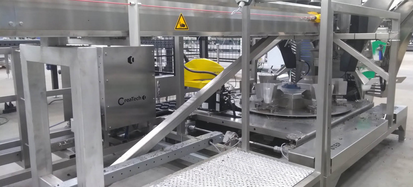 Plant sleeving machine with NEFF spindle lifting element and connecting